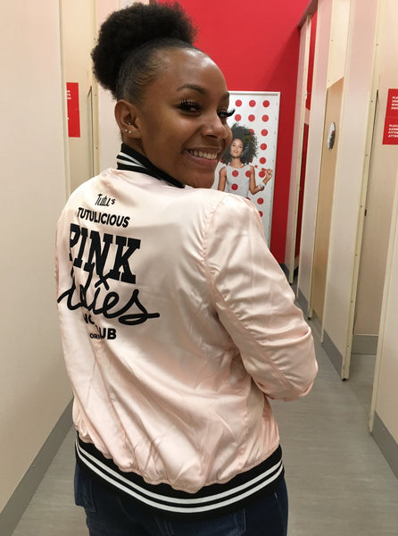 Pretty woman in a Target store wearing the Pink Ladies bomber jacket
