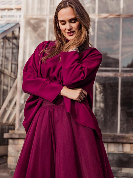 A woman wearing a Cherry Red Midi tulle skirt