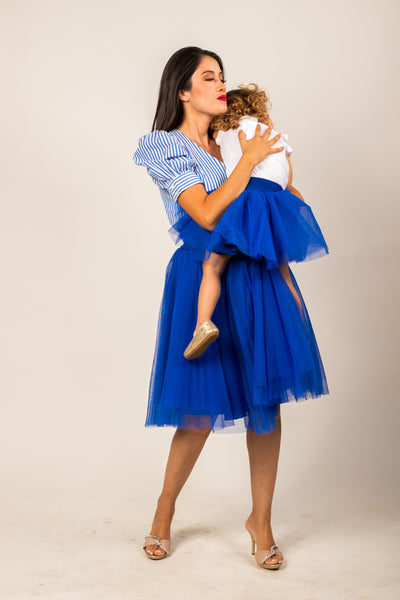 Young mom and her daughter both wearing an electric blue tulle skirt