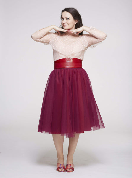 A woman wearing a Cherry Red Midi tulle skirt