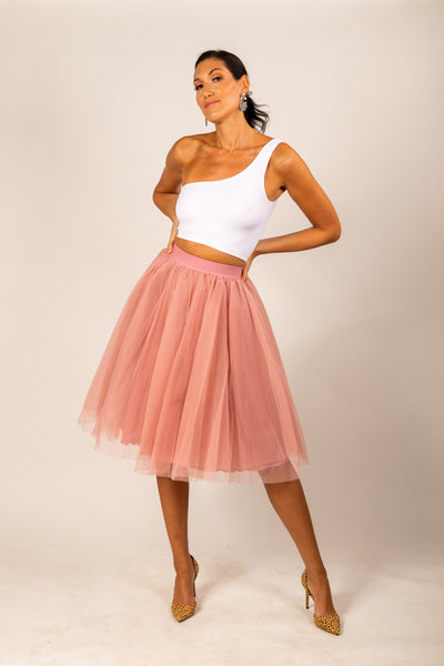 Pretty tall model wearing a light pink mid calf tulle skirt