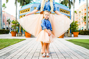 Cute little girl wearing a kid's tulle skirt in beige- mom and daughter outfit