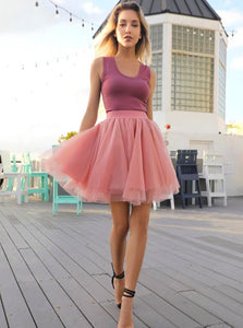 Fashion model wearing the Mini Vieux Rose tutu tulle skirt on a roof top terrace in Miami Beach