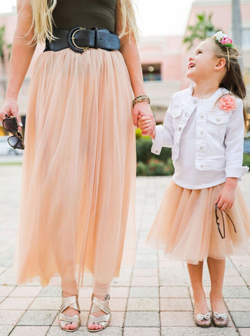 Woman wearing a Long Champagne tulle skirt 