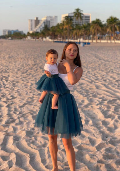 mom and daughter wearin matching tulle tutu skirts