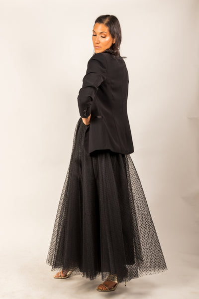 A beautiful  tall girl wearing a black dotted Gala tulle skirt