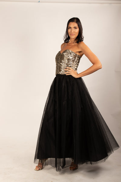 A beautiful  tall girl wearing a black dotted Gala tulle skirt