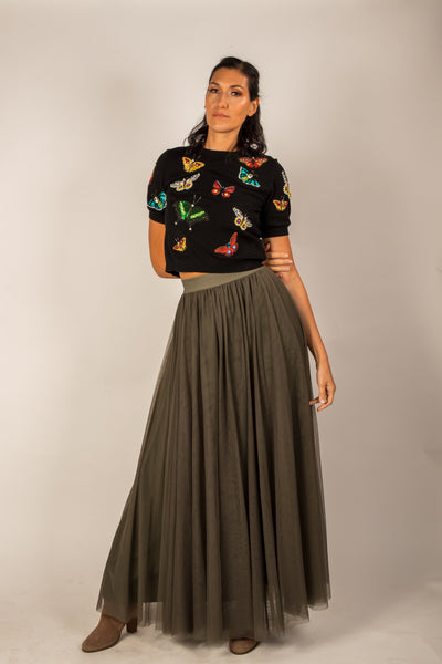 l tall girl wearing a khaki green tulle skirt