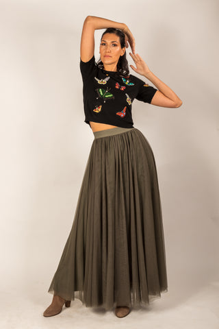 Beautiful tall girl wearing a khaki green tulle skirt