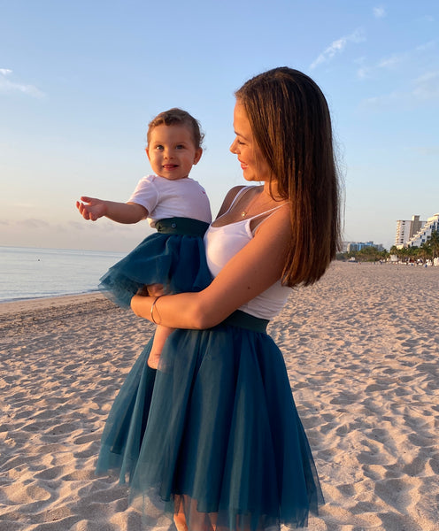 mom and daughter wearin matching tulle tutu skirts