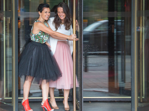 Pretty model wearing a light pink mid calf tulle skirt