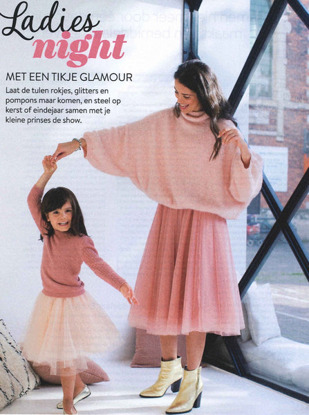 Pretty tall model wearing a light pink mid calf tulle skirt