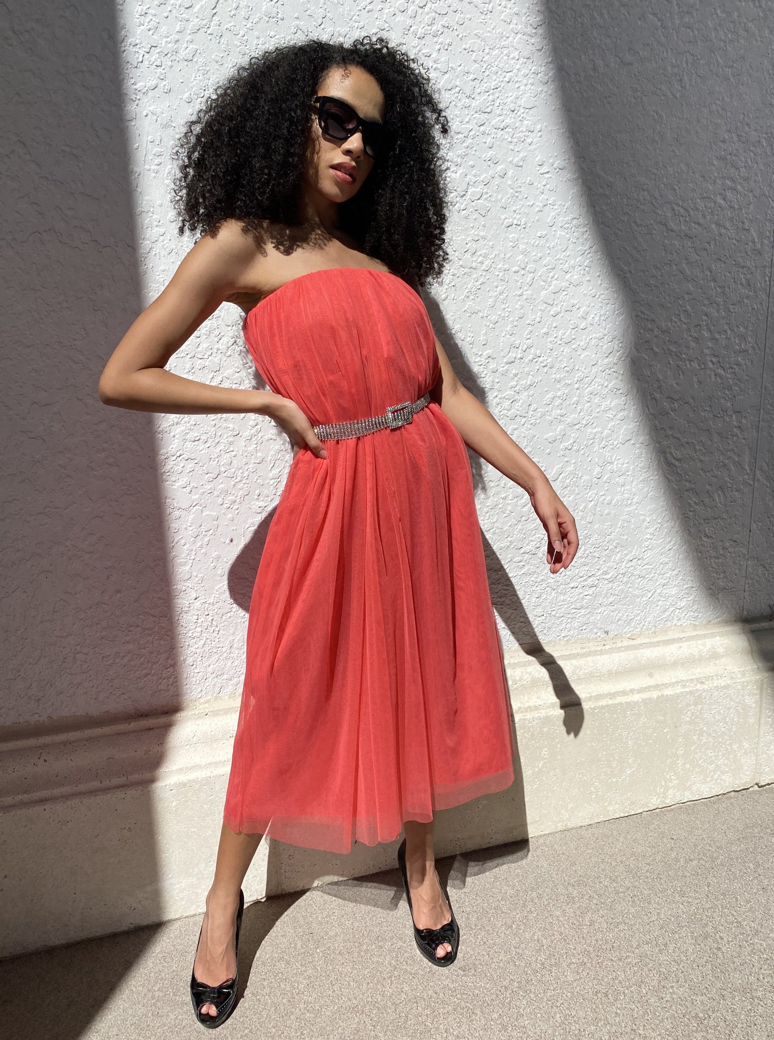 Model wearing a Long Coral Red tulle skirt as a dress