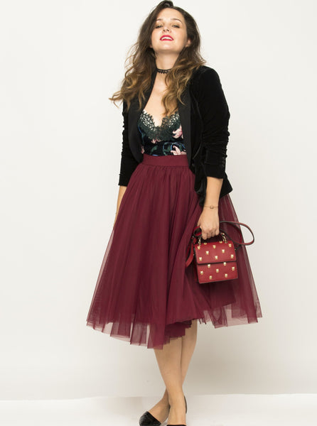 A woman wearing a Cherry Red Midi tulle skirt
