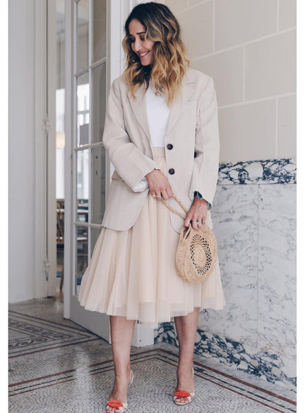 A fashionista wearing the Midi Champagne tulle skirt
