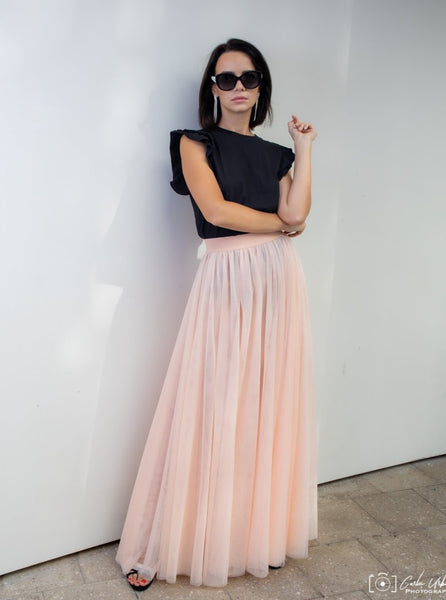 A beautiful  tall woman wearing a Powder Gala tulle skirt