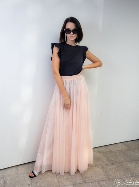 A beautiful  tall woman wearing a Powder Gala tulle skirt
