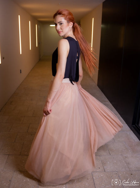 A beautiful  tall woman wearing a Champagne Gala tulle skirt