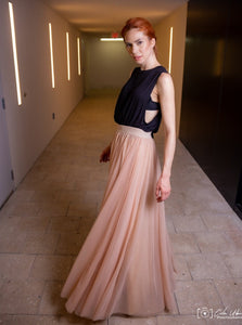 A beautiful  tall woman wearing a Champagne Gala tulle skirt