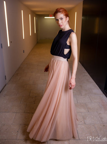 A beautiful  tall woman wearing a Champagne Gala tulle skirt