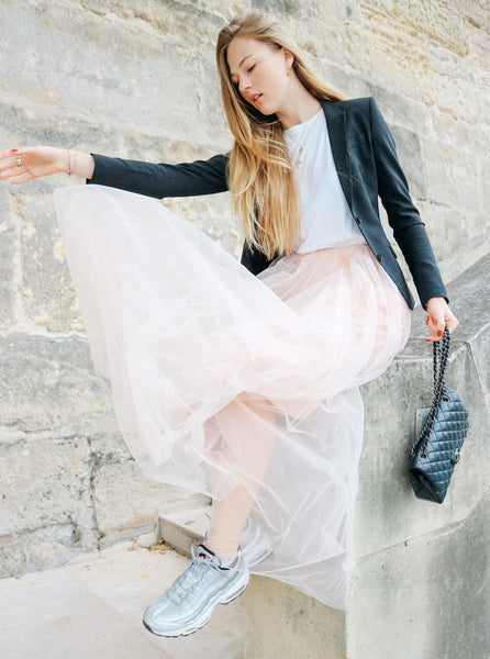 A beautiful  tall woman wearing a Powder Gala tulle skirt